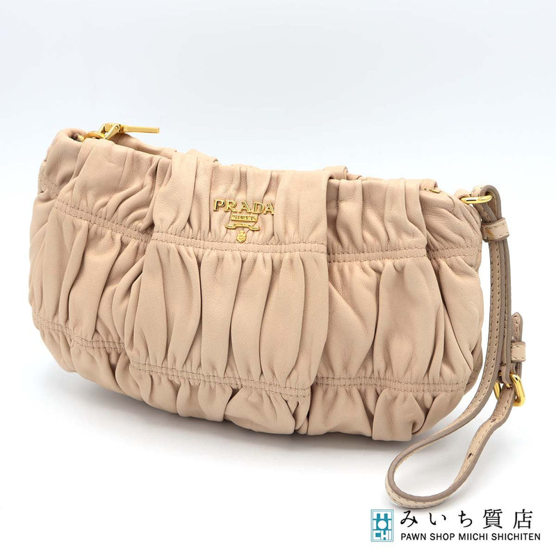 PRADA プラダ ポーチ 1N1584 クラッチバッグ ミニバッグ 化粧ポーチ ラムスキン ピンクベージュ系 22s630-1